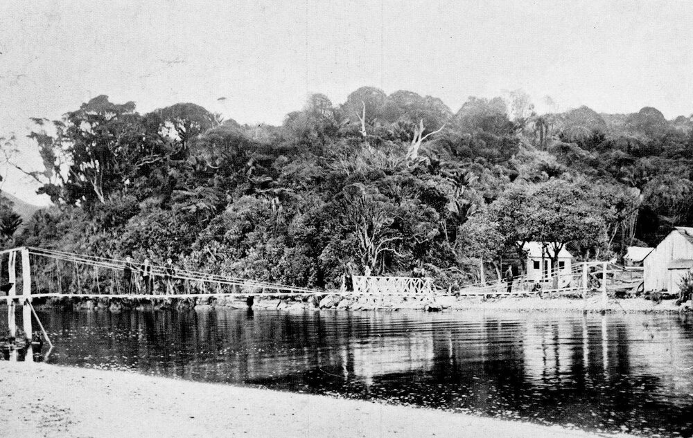 The swing bridge and sawmill at the mouth of the Patarau River, near ...
