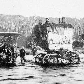 Traction steam engine hauling across the Inangahua River.