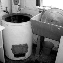 Washing copper and concrete tub.