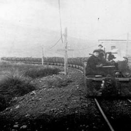 Electric loco bringing race of loaded tubs from Westport-Stockton Companys Mines.