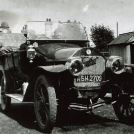 Vintage car parked in the rear yard of the Albion Hotel, Westport.ca 1912-29.