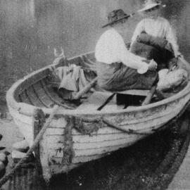 Two ladies waiting for the ferryman to row them across the Buller River.