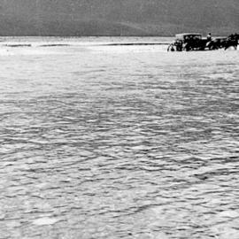 Kennedy car crossing the Waimakariri bridge.ca.1930s.