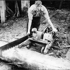 Timber worker using motorised saw Granite Creek, Kongahu 1941.