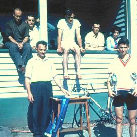 Dave Clark is presenting the cups to Brian Cameron of Nelson for the West Coast 25 mile championship ,1964. 