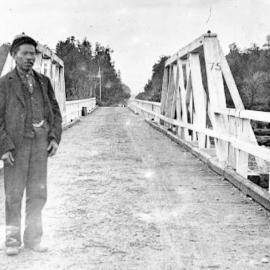 Louie on the Larrys Creek Bridge , Reefton area. 1905.
