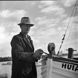 Man repairing a boat, Westport 1939.