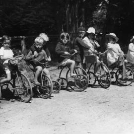 Westport children on tricycles 1940s.