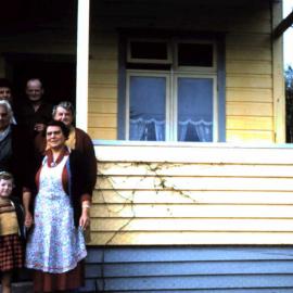 The Hibbs and Nelson families outside 1007 Main Road, Camerons, West Coast