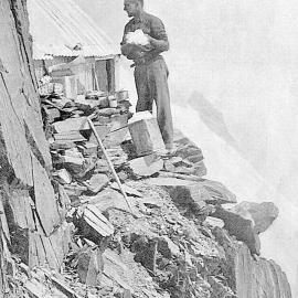 Gathering snow for cooking purposes at Pioneer Hut - height of 8000 feet. Fox Glacier.ca.1930s