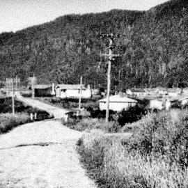 Main road, looking north from Ohau St, Dobson, 1948. Dobson mine in back ground.