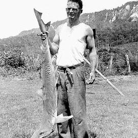 Hec Gibson with shark he caught at Point Elizabeth.