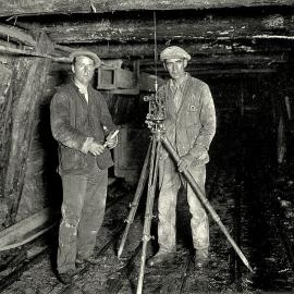 Tasman Rangi Hogg with colleague Mick Brett on the left, surveying the Blackwater Mine at Waiuta.ca.1900`s.