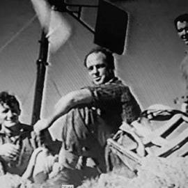 Carrying up aerial, batteries, wiring, propeller for TV reception, Mount Kelly.ca.1963-64. -ALBUM-