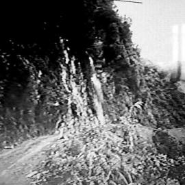 Otira Gorge below Zig Zag, using explosive to widen road. ca.1964.  - ALBUM -