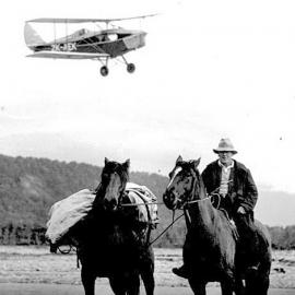 ZK-AEK overflies Postman, Charlie Smith and his packhorse, South Westland 1936.