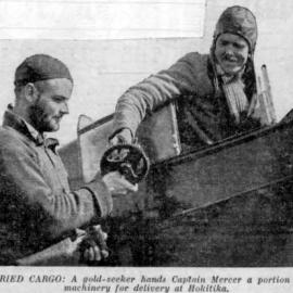 A gold seeker hands Captain Mercer machinery for delivery at Hokitika.ca.1935.