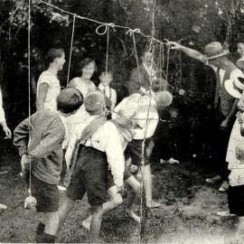 Slatey Creek sports day -  eating toffee apples on a string.