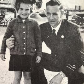 Denise Chapman tries on her father's hat.