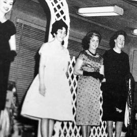 Modelling in a Greymouth store.- Miss Scandrett (Miss Canterbury) with Miss Boucher, Mrs Blackmore and Mrs McDonald.1960.