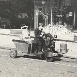 Nicol (Nicky) Paton on his street cleaning scooter, Greymouth *ALAN WISDOM COLLECTION* 