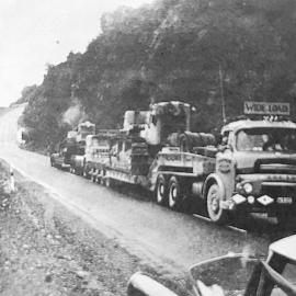 Heavy machinery heads south to finish Haast Road .1960.