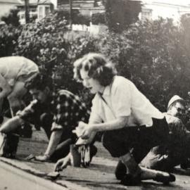 Volunteers paint the Greymouth youth hostel roof *ALAN WISDOM COLLECTION* 