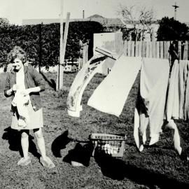Marie Williams hanging washing out , Gilmer Hotel back yard .1969.