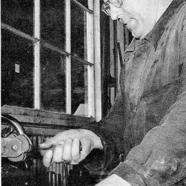 Foreman fitter and turner, Cyril Hector - working on the big lathe out at Strongman Mine.ca.1965.