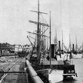 Fourteen Steamers and a Sailing Vessel docked together in Greymouth. 1911