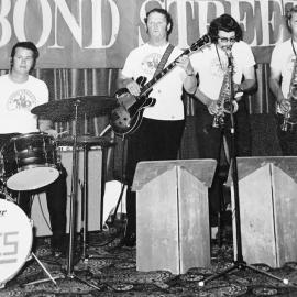 Alan Wisdom on saxophone, Ken Groom on the drums John Smith on one of the saxophones.