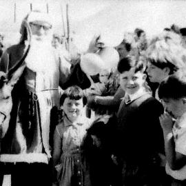 Fred Russ at Camerons school with Christmas presents and Jimmy the Deer.