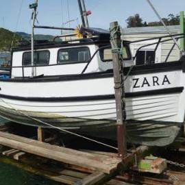 The Lifeboat of the old Greymouth or Westport Dredge.  - 2 PHOTOS -