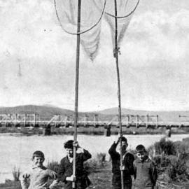 On an island in the Hokitika River - boys posing with their home- made scoop nets.1932.