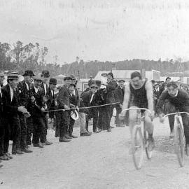 Bicycle race during the 1913 waterfront strike, McGowan Street, Runanga