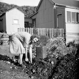 May D'Ath filling the Coal Bucket, Denniston. June ,1940.
