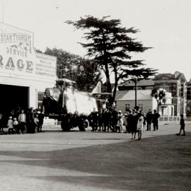 Guy Menzies and wrecked Avro Sports Avian "Southern Cross Junior" G-ABCF on a truck at Hokitika.1931.