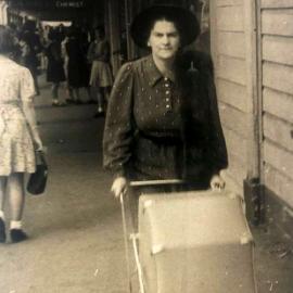 Mavis Langton walking Brian Langton up Palmerston St 1943