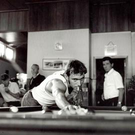 Cyril Win playing pool at the Club Hotel in Hokitika.1971