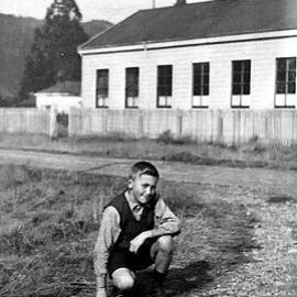 Joe Parkinson outside the school hall on the corner of Potter and Dick St, Reefton, ca 1940's.