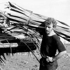 Ron Prestage cutting flax, Westport