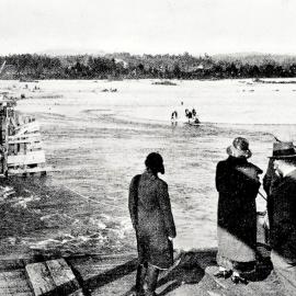 Blackball residents waiting to cross the broken bridge on the ropeway. 1926.