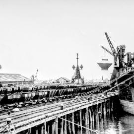  Wagons filled with coal on the Greymouth wharf, and ship the Karepo.1920`s