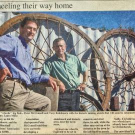 Peter McConnell and Tony Kokshoorn with the historic mining wheels returned to Blackball.
