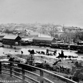 Greymouth railway station in flood, and elevated view of town