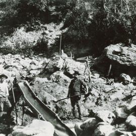 Charleston gold miners at work on their sluice box