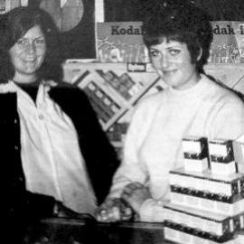 Phyllis Waghorn and Annette Latham at D J Latham Chemist Shop, Reefton. 1970.  - 2 PHOTOS -