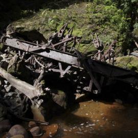 Remains of a 4- wheel centre rail brake 'Fell' van in Fords Creek Blackball