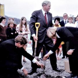 Prime Minister Norman Kirk planting a Totara at Runanga. 1970`s.