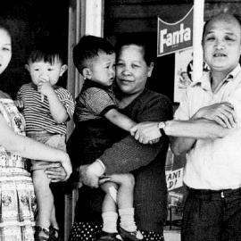 The Jan family stand outside the On Lee fruit shop in Reefton. ca .1965.